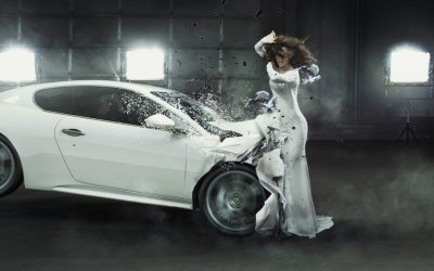 Alluring fashionable woman in the middle of car crash