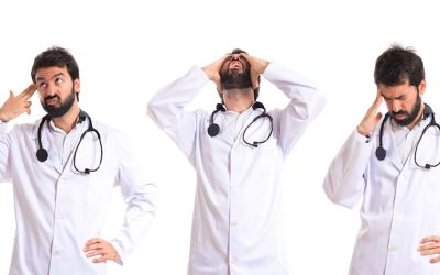 Frustrated doctor over isolated white background