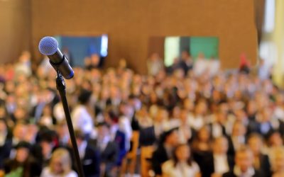 Blurred background of public event exhibition hall show concept with microphones