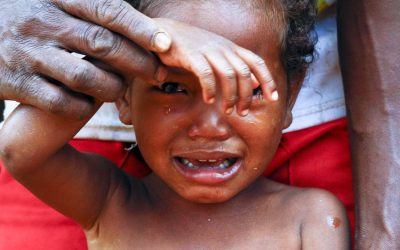 Crying girl with tear on cheek - poor african child