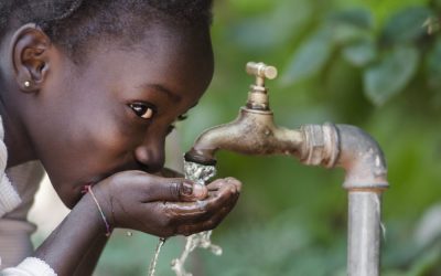 Social Issues: African Black Child Drinking Fresh Water From Tap