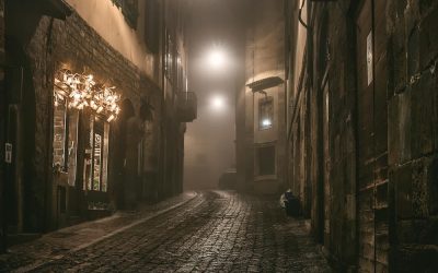 Old European narrow empty street of a medieval town on a foggy evening. Taken in Bergamo, Citta Alta